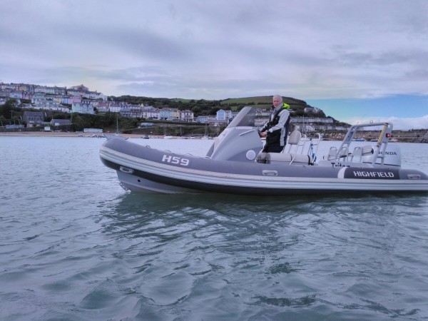 Crawford on a powerboat